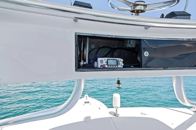 Slide: The Image of 1998 Hatteras 60 Convertible yacht with open electronics compartment, ocean view. - 10