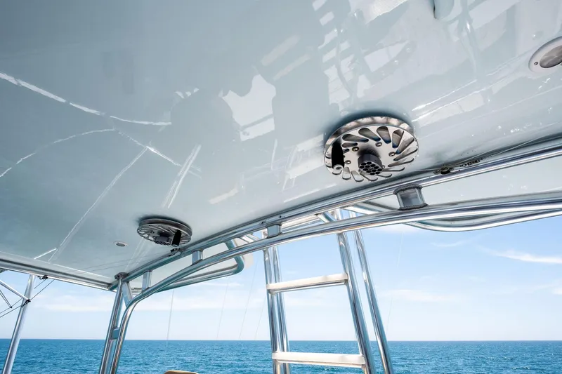 Slide: The Image of 1998 Hatteras 60 Convertible yacht ceiling with speakers and ladder, ocean view. - 17