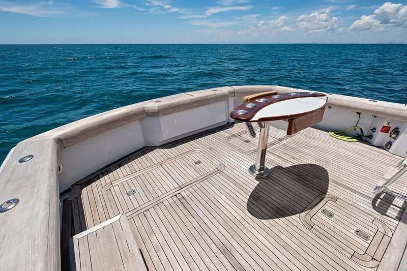 Slide: The Image of 1998 Hatteras 60 Convertible yacht deck with ocean view and fishing station. - 22