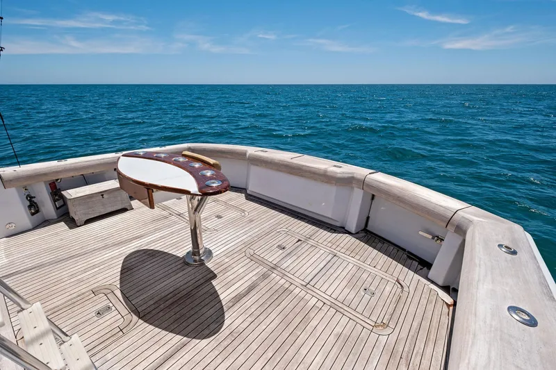 Slide: The Image of 1998 Hatteras 60 Convertible yacht deck with ocean view and fishing station. - 24