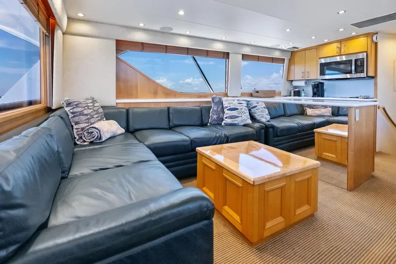 Slide: The Image of Luxurious interior of 1998 Hatteras 60 Convertible yacht with leather seating and modern kitchen. - 30