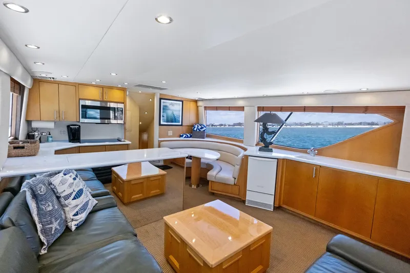 Slide: The Image of Luxurious interior of 1998 Hatteras 60 Convertible yacht with modern kitchen and ocean view. - 31