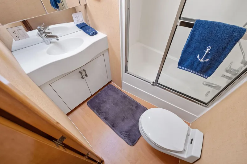 Slide: The Image of Bathroom interior of 1998 Hatteras 60 Convertible yacht with shower and sink. - 44