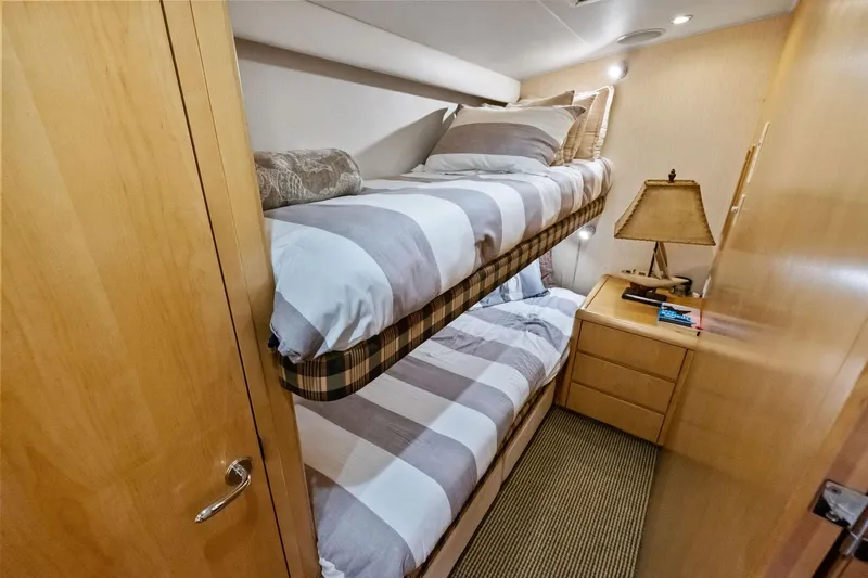 Slide: The Image of Cozy bunk bed cabin in 1998 Hatteras 60 Convertible yacht. - 45