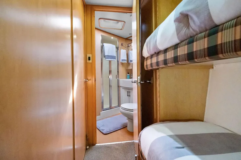 Slide: The Image of Interior of 1998 Hatteras 60 Convertible yacht with bunk beds and bathroom. - 46