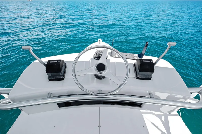 Slide: The Image of Helm of 1998 Hatteras 60 Convertible yacht with ocean view. - 8