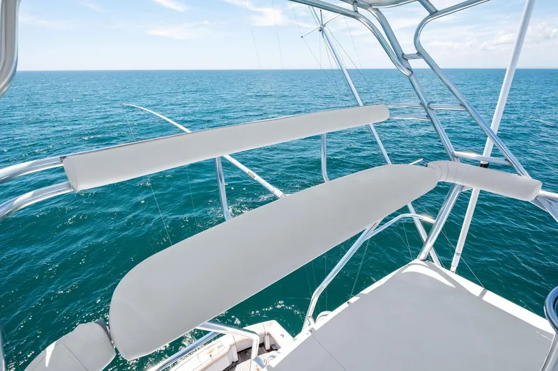 Slide: The Image of 1998 Hatteras 60 Convertible yacht with ocean view from upper deck. - 9