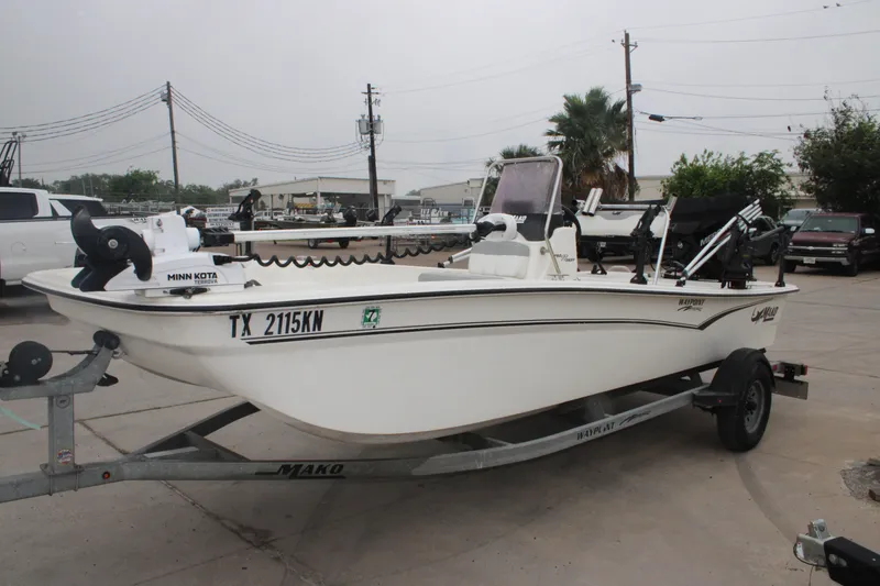 Slide: The Image of 2021 Mako Pro Skiff 17 CC boat on trailer, equipped with Minn Kota motor. - 6