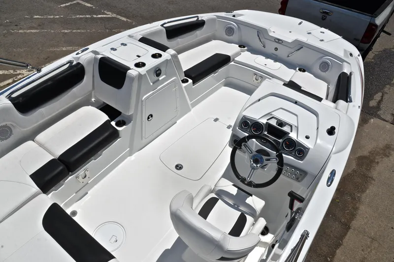 Slide: The Image of 2018 Tahoe 1950 boat interior with sleek seating and modern dashboard design. - 19