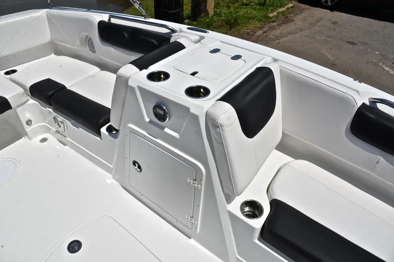 Slide: The Image of Interior of a 2018 Tahoe 1950 boat with white and black seating. - 22
