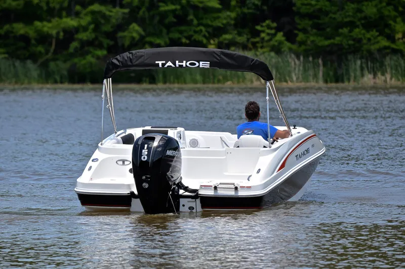 Slide: The Image of A 2018 Tahoe 1950 boat with a Mercury 150 engine on a calm lake. - 8