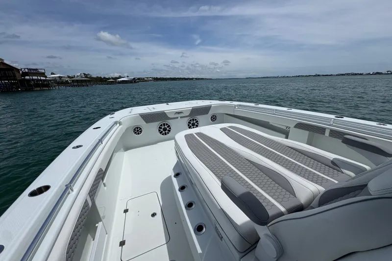 Slide: The Image of 2025 Invincible 40 Catamaran on calm waters, showcasing spacious seating and sleek design. - 19