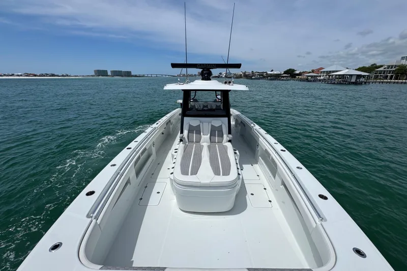 Slide: The Image of 2025 Invincible 40 Catamaran cruising on open water, showcasing sleek design and spacious deck. - 21