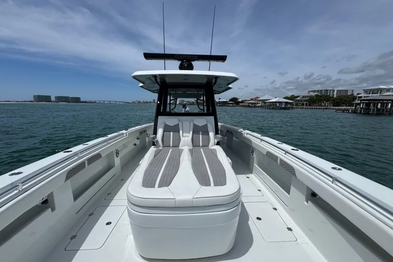 Slide: The Image of 2025 Invincible 40 Catamaran on water, showcasing sleek design and spacious deck. - 22