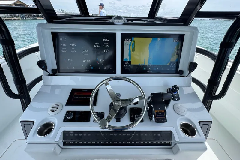 Slide: The Image of Cockpit of 2025 Invincible 40 Catamaran with advanced navigation displays and controls. - 33