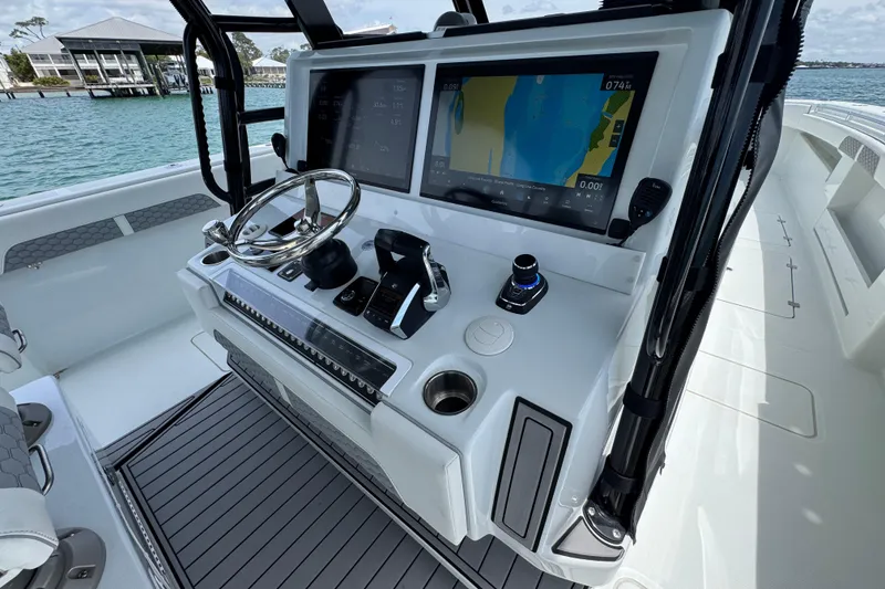 Slide: The Image of Helm of 2025 Invincible 40 Catamaran with advanced navigation system and sleek design. - 34