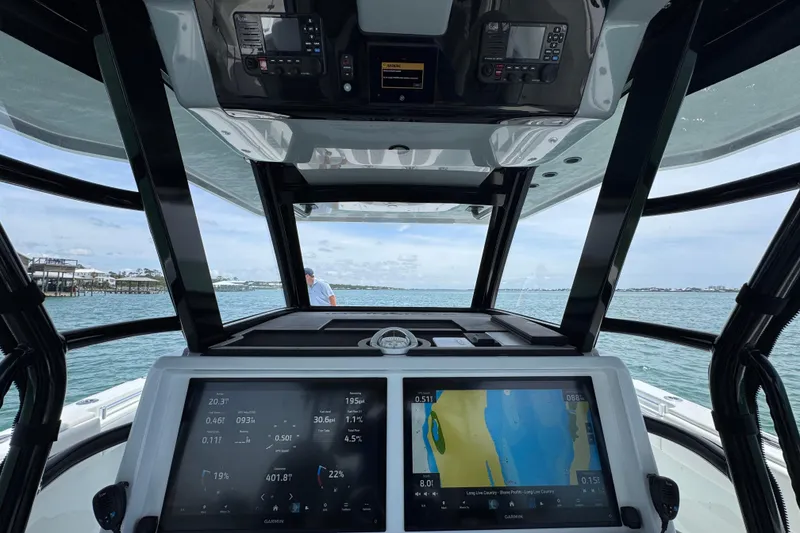 Slide: The Image of Cockpit view of 2025 Invincible 40 Catamaran with advanced navigation displays. - 35