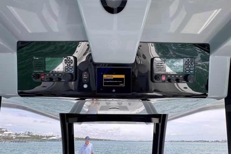Slide: The Image of 2025 Invincible 40 Catamaran dashboard with advanced navigation and communication systems. - 36