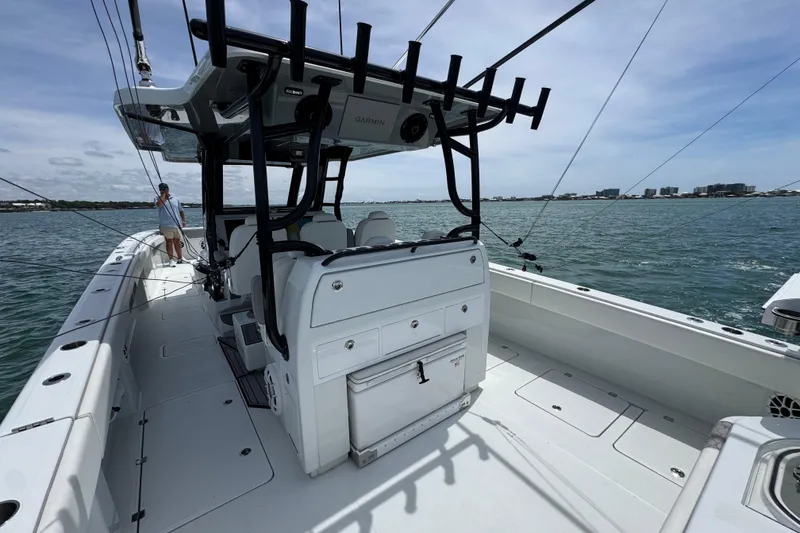 Slide: The Image of 2025 Invincible 40 Catamaran on water, showcasing spacious deck and modern design. - 37