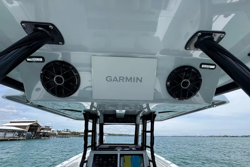 Slide: The Image of 2025 Invincible 40 Catamaran with Garmin electronics on open water. - 39