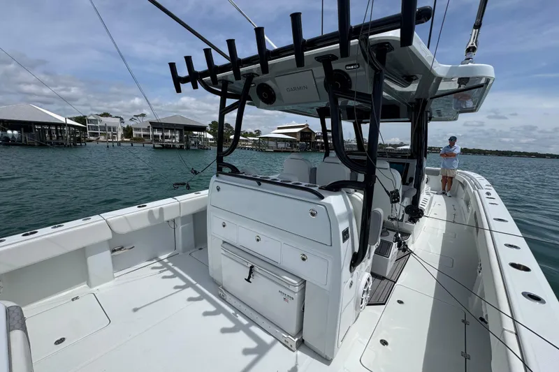 Slide: The Image of 2025 Invincible 40 Catamaran on water, featuring spacious deck and modern equipment. - 40