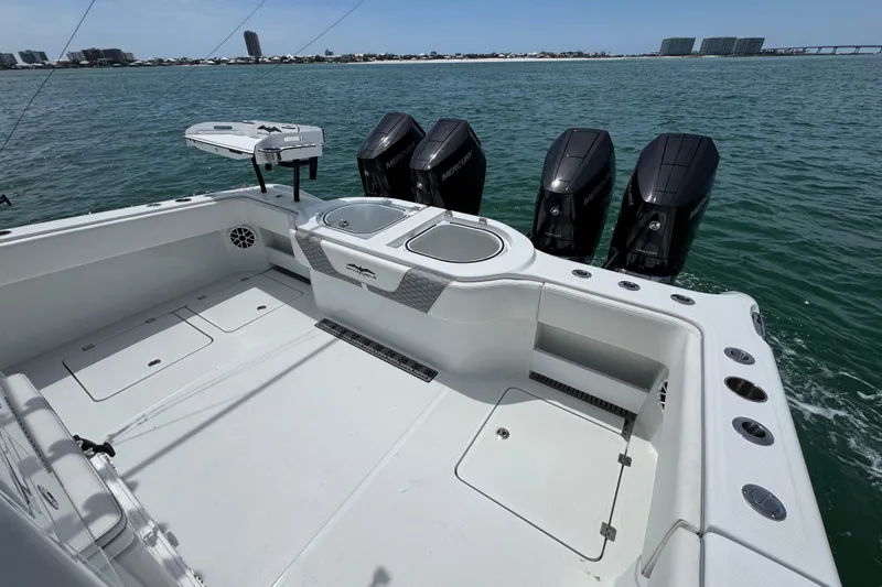 Slide: The Image of 2025 Invincible 40 Catamaran with four Mercury engines on open water. - 41