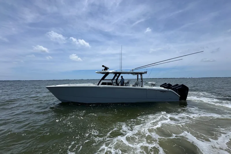 Slide: The Image of 2025 Invincible 40 Catamaran on open water, showcasing sleek design and powerful engines. - 7