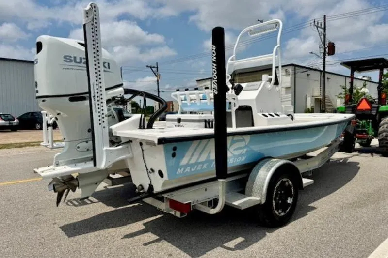 Slide: The Image of 2024 Majek 18 M2 boat on trailer with Suzuki outboard motor. - 3