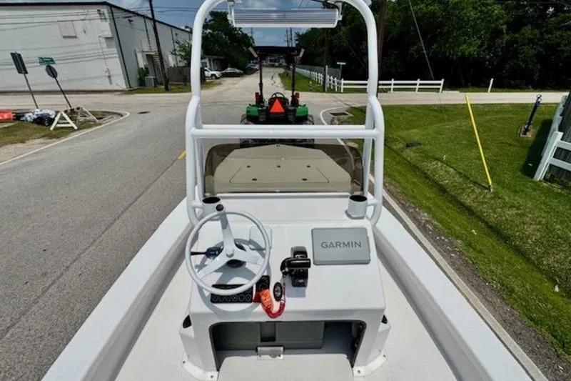 Slide: The Image of 2024 Majek 18 M2 boat console with Garmin navigation, parked on a street. - 9
