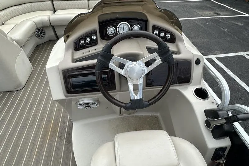 Slide: The Image of 2026 Bennington 2250 GSR boat dashboard with steering wheel and control panel. - 13