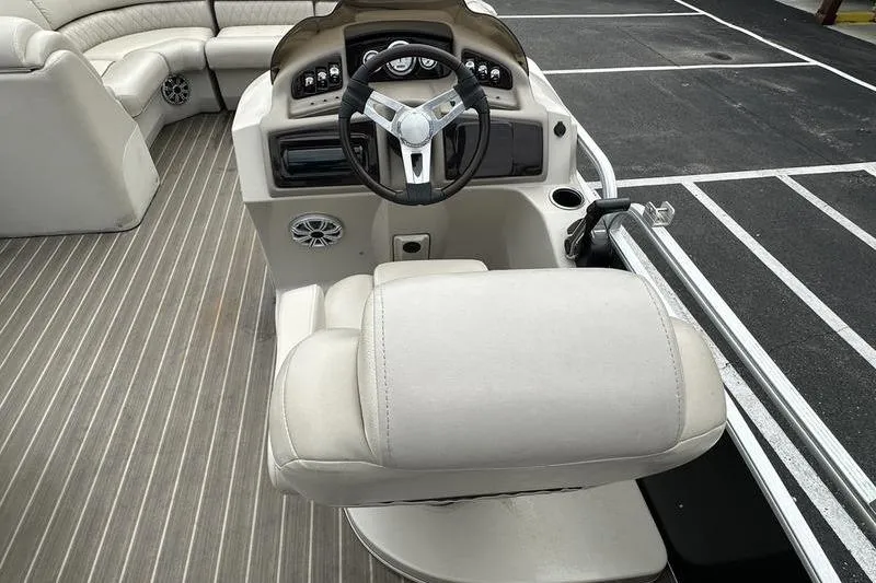 Slide: The Image of 2026 Bennington 2250 GSR boat interior with steering wheel and seating. - 15