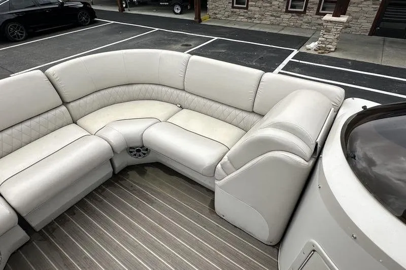 Slide: The Image of Luxurious seating on 2026 Bennington 2250 GSR pontoon boat, featuring plush white upholstery. - 16