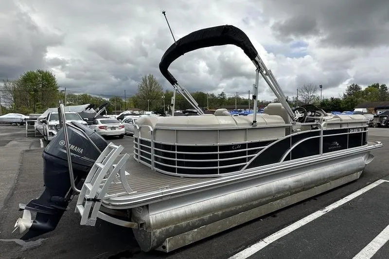 Slide: The Image of 2026 Bennington 2250 GSR pontoon boat with Yamaha motor in parking lot. - 4