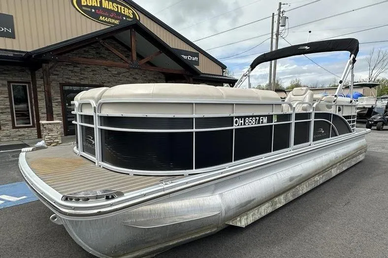 Slide: The Image of 2026 Bennington 2250 GSR pontoon boat parked outside dealership. - 7