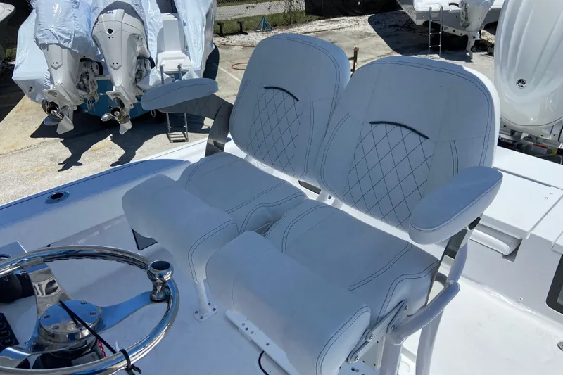 Slide: The Image of Luxury seating on 2026 Sportsman Masters 247 Bay Boat with dual engines in background. - 12