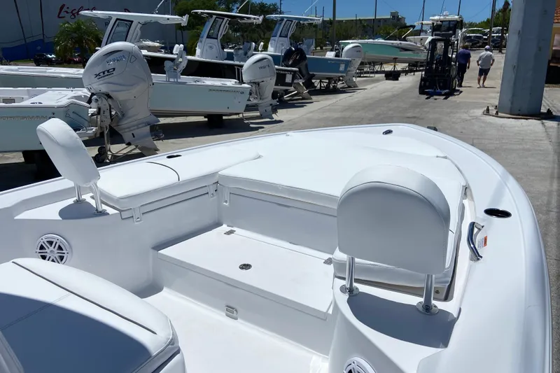 Slide: The Image of 2026 Sportsman Masters 247 Bay Boat with Yamaha engine, docked at a marina. - 15