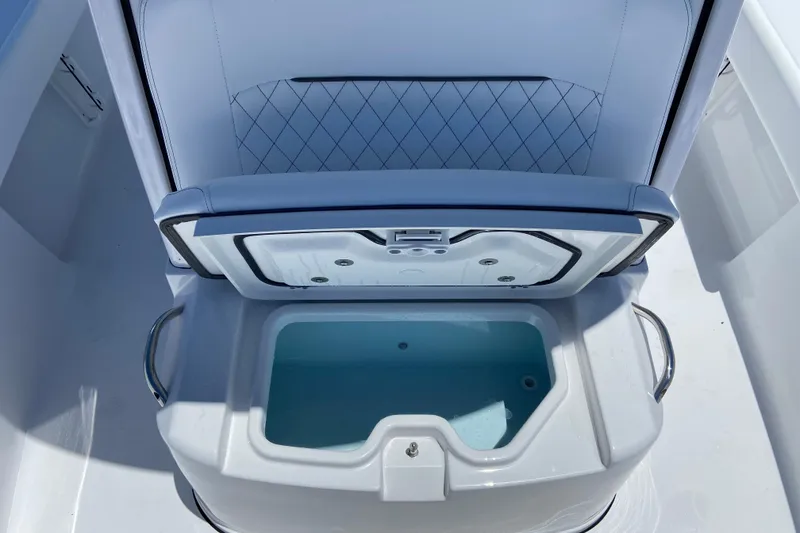 Slide: The Image of 2026 Sportsman Masters 247 Bay Boat livewell with open lid, showcasing interior design. - 17