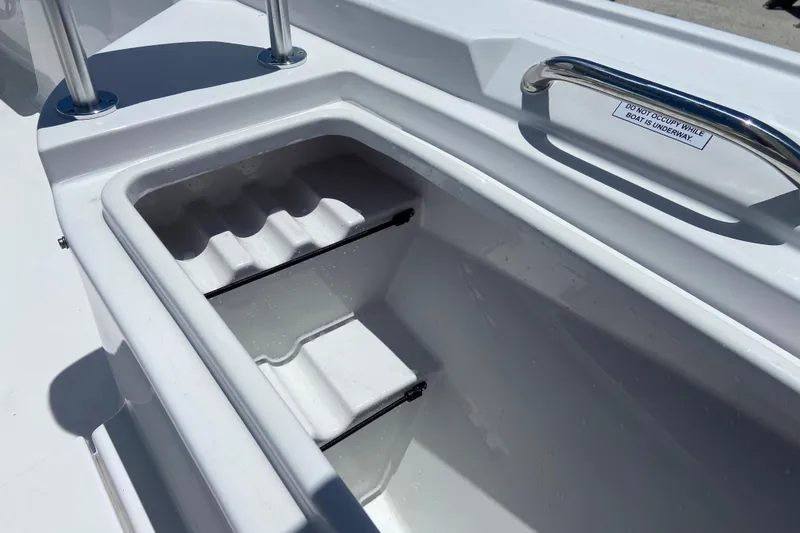 Slide: The Image of Storage compartment on 2026 Sportsman Masters 247 Bay Boat, featuring sleek design and safety handle. - 18