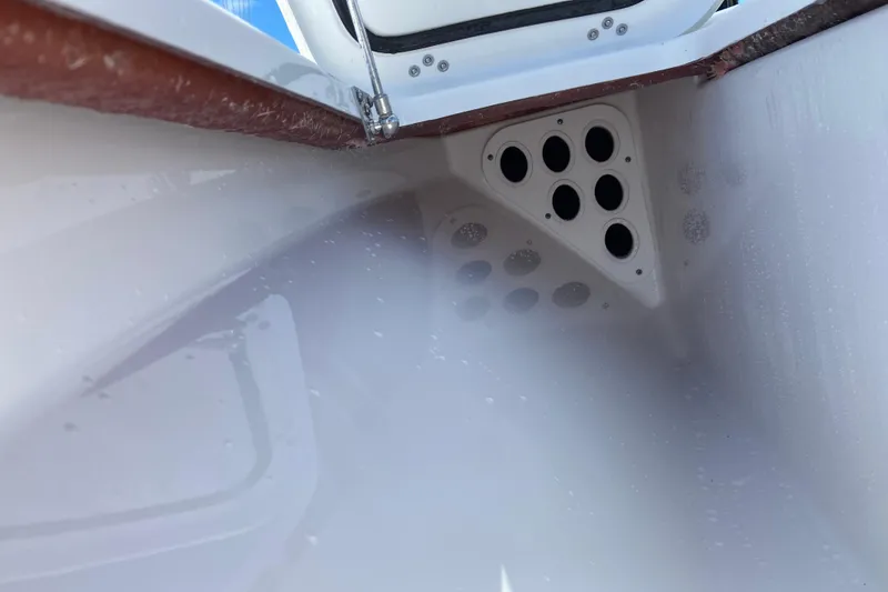 Slide: The Image of Interior view of a 2026 Sportsman Masters 247 Bay Boat, showcasing storage compartment details. - 19