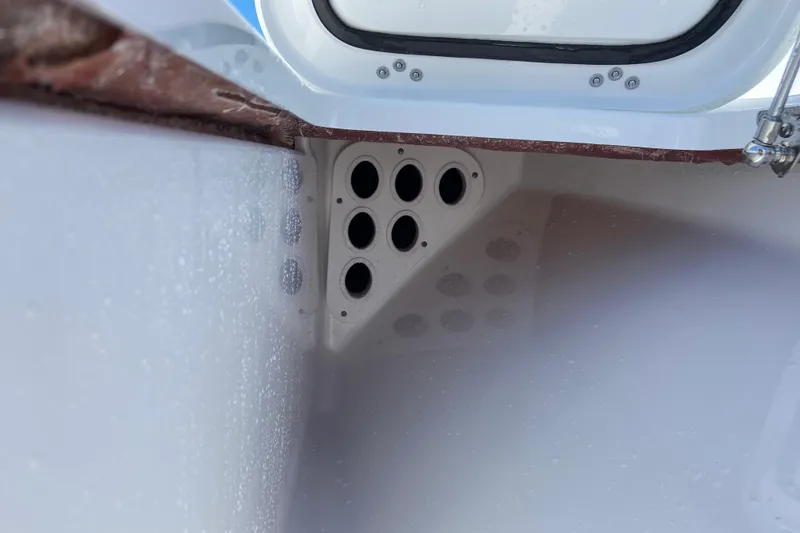 Slide: The Image of Interior view of 2026 Sportsman Masters 247 Bay Boat with rod holder detail. - 21