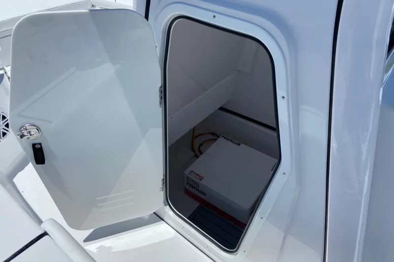 Slide: The Image of Open storage compartment on 2026 Sportsman Masters 247 Bay Boat, showing interior space. - 23