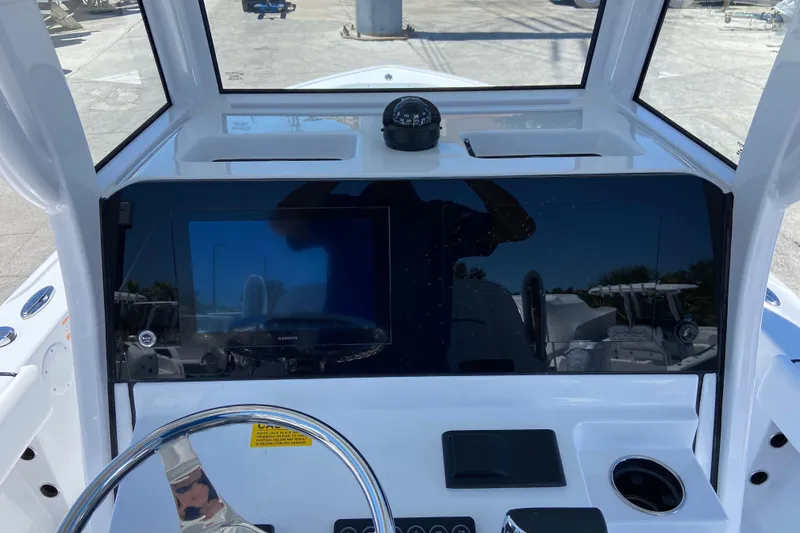 Slide: The Image of 2026 Sportsman Masters 247 Bay Boat dashboard with steering wheel and navigation display. - 6