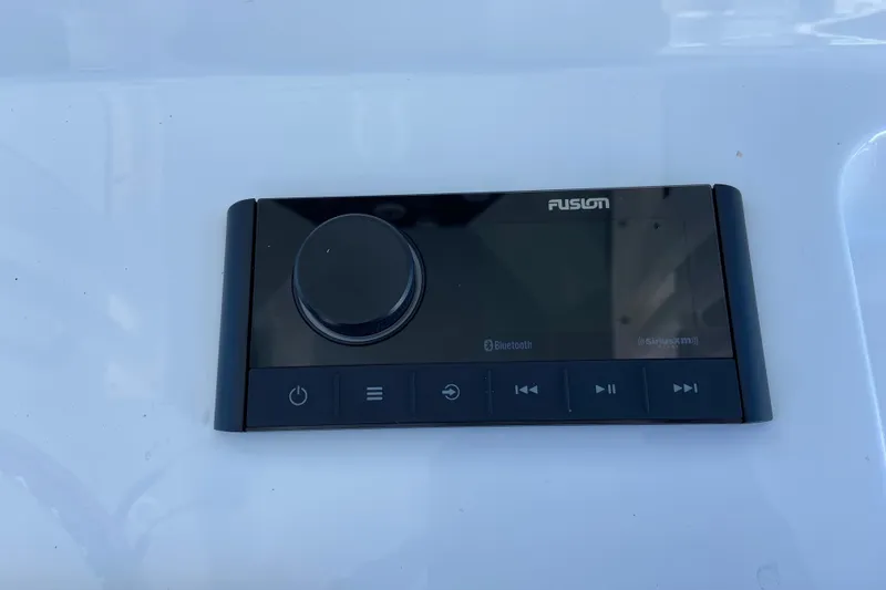 Slide: The Image of Fusion audio control panel on 2026 Sportsman Masters 247 Bay Boat dashboard. - 8
