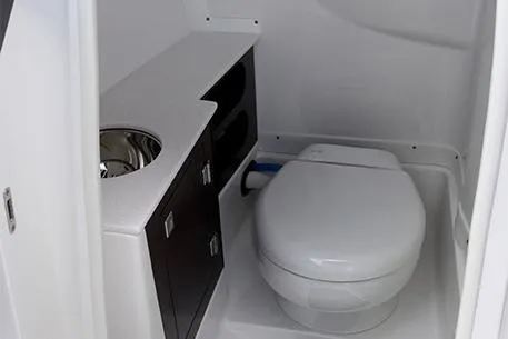 Slide: The Image of Manufacturer Provided Image: 2025 Monterey 255SS Super Sport boat bathroom with toilet and sink. - 9