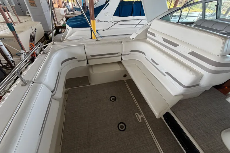 Slide: The Image of 1998 Formula 34 Performance Cruiser interior with white seating and sleek design. - 12