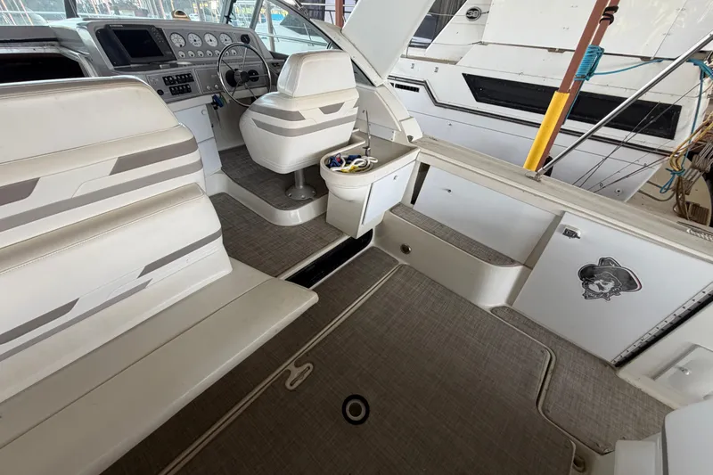 Slide: The Image of 1998 Formula 34 Performance Cruiser interior with helm, seating, and nautical decor. - 13