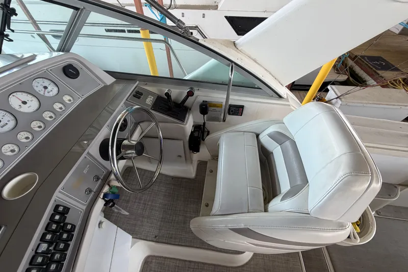 Slide: The Image of Cockpit of a 1998 Formula 34 Performance Cruiser with steering wheel and control panel. - 18