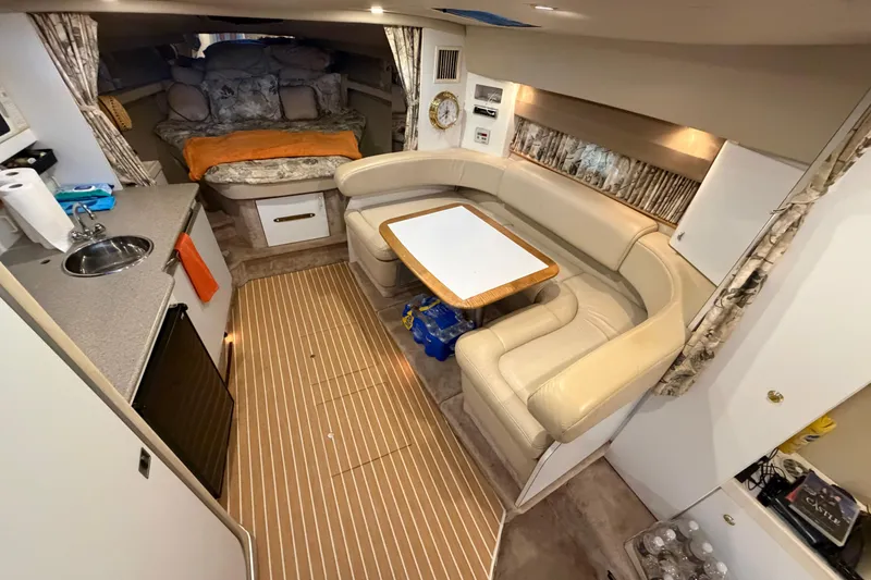 Slide: The Image of Interior of a 1998 Formula 34 Performance Cruiser with cozy seating and kitchenette. - 20