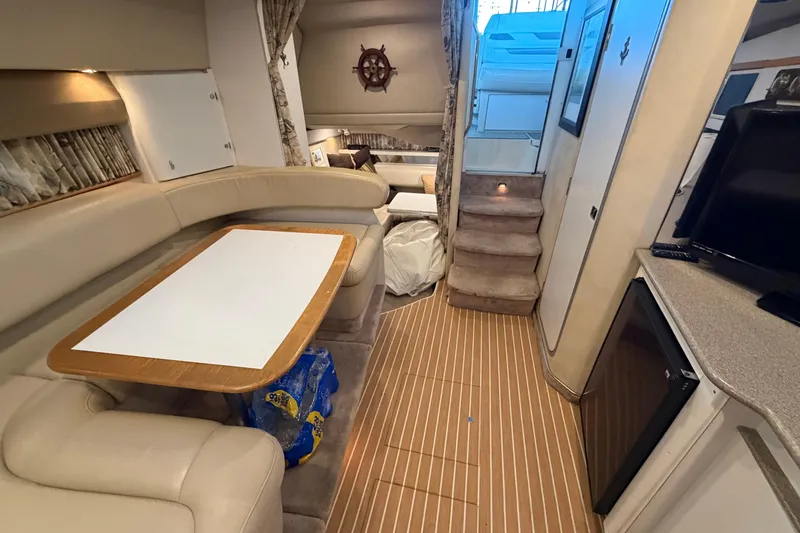 Slide: The Image of Interior of 1998 Formula 34 Performance Cruiser with cozy seating and wooden flooring. - 27