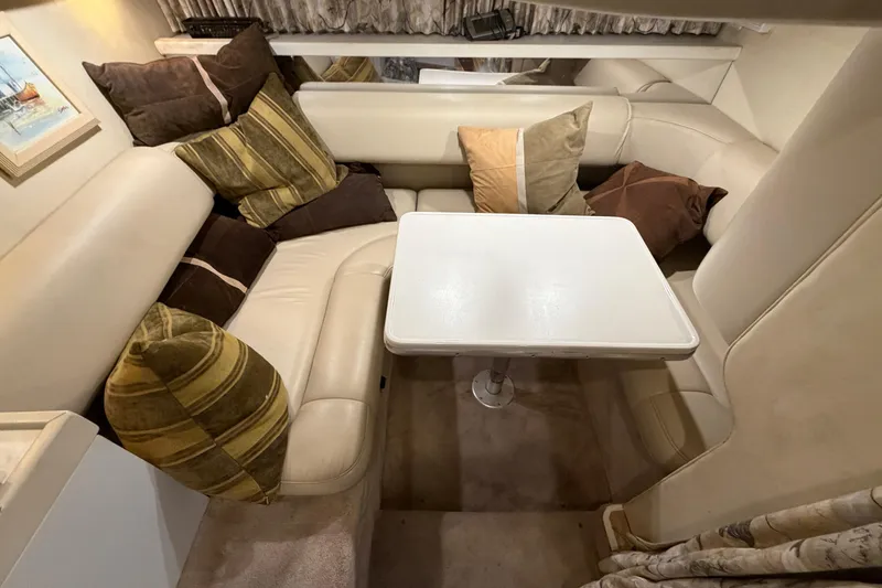 Slide: The Image of Interior of 1998 Formula 34 Performance Cruiser with cozy seating and decorative pillows. - 28